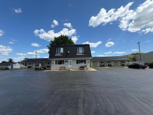 a parking lot in front of a building at Perth Plaza Inn & Suites in Perth