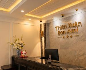 a office with a desk with a computer on a wall at Bon Ami Hotel - Thiên Xuân in Ho Chi Minh City +59 photos