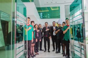 a group of people standing in front of a glass wall at Eurotel Boracay in Boracay