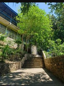 a set of stairs in front of a building at Monique Beach Resort by Hiverooms in Carmen