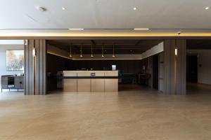 a large room with a counter in the middle of a building at Costa Hotel Nilai in Nilai