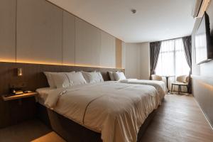 a hotel room with a large bed in a room at Costa Hotel Nilai in Nilai +54 photos
