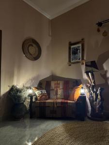 a living room with a couch and a lamp at Meru Nest Arusha in Arusha