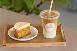 a tray with a piece of cake and a drink at DEAR MOM - Hotel & Cafe in Onjuku