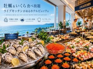 a buffet of food on display in a restaurant at Livemax Resort Mihara Onsen Seafront in Mihara