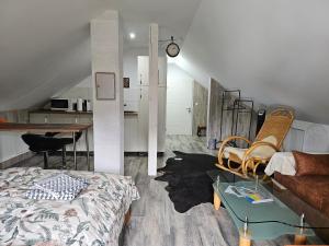 a living room with a bed and a table at Aluston in Hannover