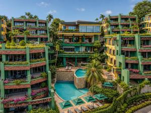 an aerial view of a building with a swimming pool at Kata Sea View Sanctuary in Kata Beach
