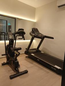 a room with two exercise bikes and a treadmill at Costa Hotel Nilai in Nilai