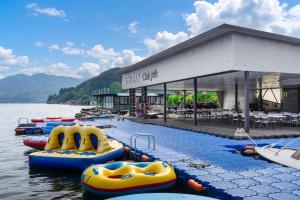 a row of inflatable boats in a body of water at Gapyeong the Bay Resort in Gapyeong
