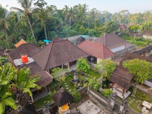 an aerial view of a house with roofs at Aruna House in Ubud
