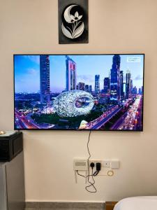 a flat screen tv hanging on a wall at Imanis comfort in Ongata Rongai 