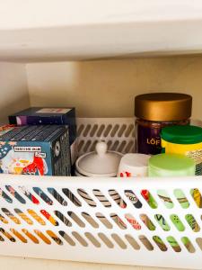 a shelf with food and other items on it at Camper Somá in Muonio