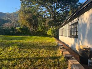a yard next to a building with a window at 399 Place in Umtali