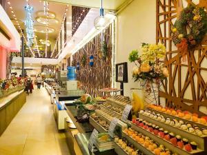 a grocery store aisle with fruits and vegetables on display at Paradise Garden Hotel and Convention Center Boracay Powered by ASTON in Boracay