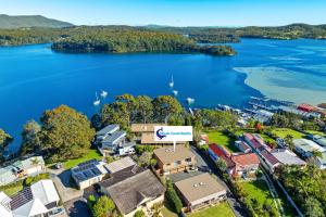 an aerial view of a town next to a body of water at Forsters Bay Haven in Narooma