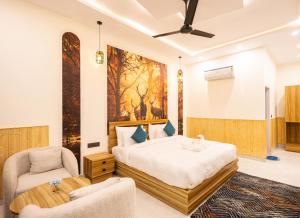 a bedroom with a bed and a chair at Tiger Aura Resort in Rāmnagar