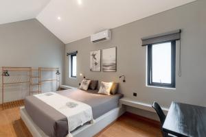 a bedroom with a large bed and a window at Iris Apartment in Dalung +16 photos