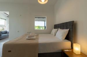 a bedroom with a large bed in a room at Green Galini Villa Pelion - the small unit in Platanidia +20 photos