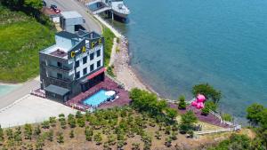 an aerial view of a building next to the water at Daebudo (Yeongheungdo) Dunia Spa Pension in Incheon