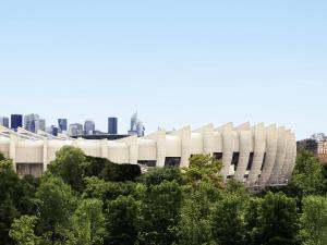 a large white stadium with a city in the background at ibis Styles Paris 16 Boulogne in Paris