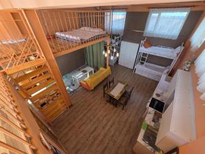 an overhead view of a dorm room with bunk beds at Danista Nomads Tour Hostel in Ulaanbaatar +65 photos