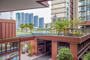 an apartment building with a view of the city at Metropole Thu Thiem Condo Apartment in Ho Chi Minh City