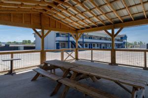 a wooden picnic table sitting on top of a deck at Days Inn by Wyndham Greeneville in Greeneville