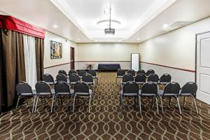 a conference room with chairs and a podium at La Quinta by Wyndham Denver Gateway Park in Denver +22 photos