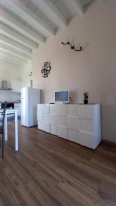 a living room with a desk with a laptop on it at Cavour 35 in Sulbiate
