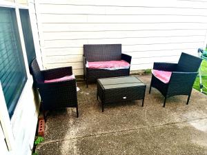 a couple of chairs and a table on a patio at Trunks up! Spacious home ready for a fun time! in Lancaster