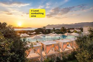 a view of a resort with aigil swimming area at Valamar Lacroma Hotel in Dubrovnik