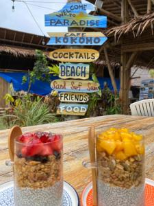 two containers of fruit and nuts on a table at The Kokomo Siargao in General Luna