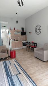 a living room with a couch and a table at Victoria's dream in Filiatra