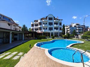 a large swimming pool in front of a building at Семеен хотел"Свети Георги" in Burgas