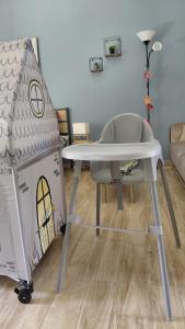 a table and a play house in a room at Victoria's dream in Filiatra