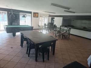 a room with a ping pong table and pool tables at Fourways guesthouse & spa in Fourways
