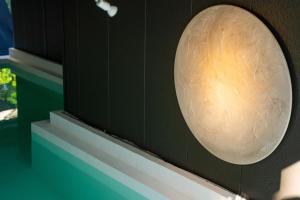 a orb on the wall of a building at Villa LUAR in Minamiawaji