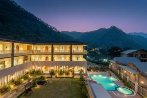 an exterior view of a resort with a swimming pool at Moustache Select Rishikesh Mohanchatti in Mohan Chatti