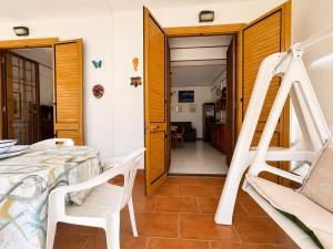a room with a bunk bed and a ladder at Oasi Palma - Mondello in Palermo