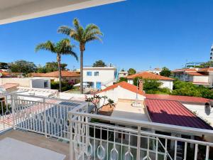 a view from the balcony of a house with palm trees at Oasi Palma - Mondello in Palermo