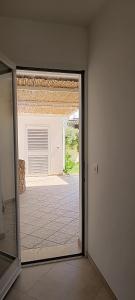 an empty room with a door to a patio at LA PERLA, comfort e relax in Vignacastrisi