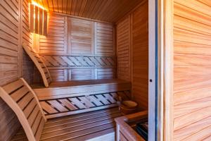 a wooden sauna with a wooden stairs in it at Villa Bali Oasis Grand Wellness in Stolac