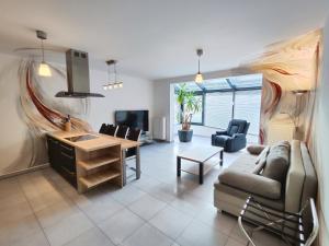 a living room with a couch and a table at Apartmány Duo in Dačice