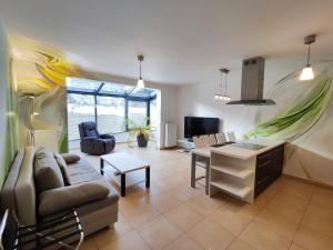 a living room with a couch and a table at Apartmány Duo in Dačice