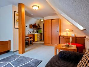 a living room with a couch and a table at Biker Hotel Harmonie in Bad Grund
