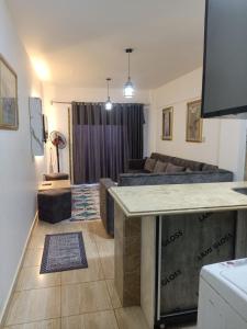 a living room with a couch and a table at قريه سورتلاج مرسي مطرح الفيو المميز in Marsa Matruh +53 photos