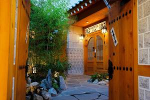 an entrance to a house with a wooden door at Hotel Jak Insadong by Anook in Seoul