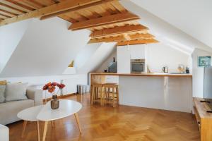 a living room with a couch and a table at Kralova Apartment in Modra in Modra