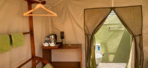 a bathroom with a shower and a toilet in a tent at COCO FOREST CAMPING - Luxury Glamping & Villa - ONLY FOR FOREIGN BOOKINGS in Kurunegala