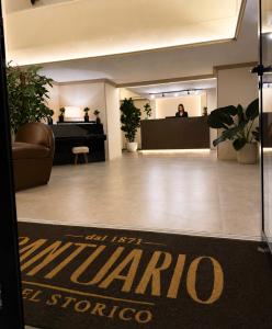 a lobby of a store with a person in the background at Hotel Santuario Pompei in Pompei +18 photos